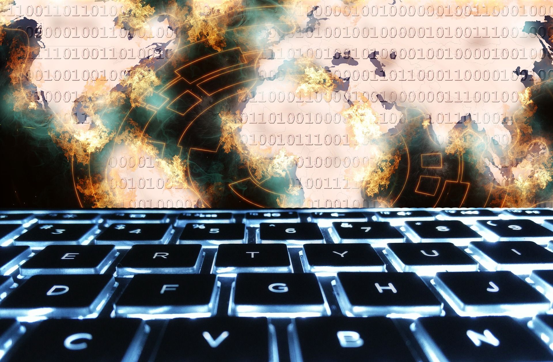 Imagen compuesta con un teclado luminoso en primer plano y explosiones con código binario superpuesto