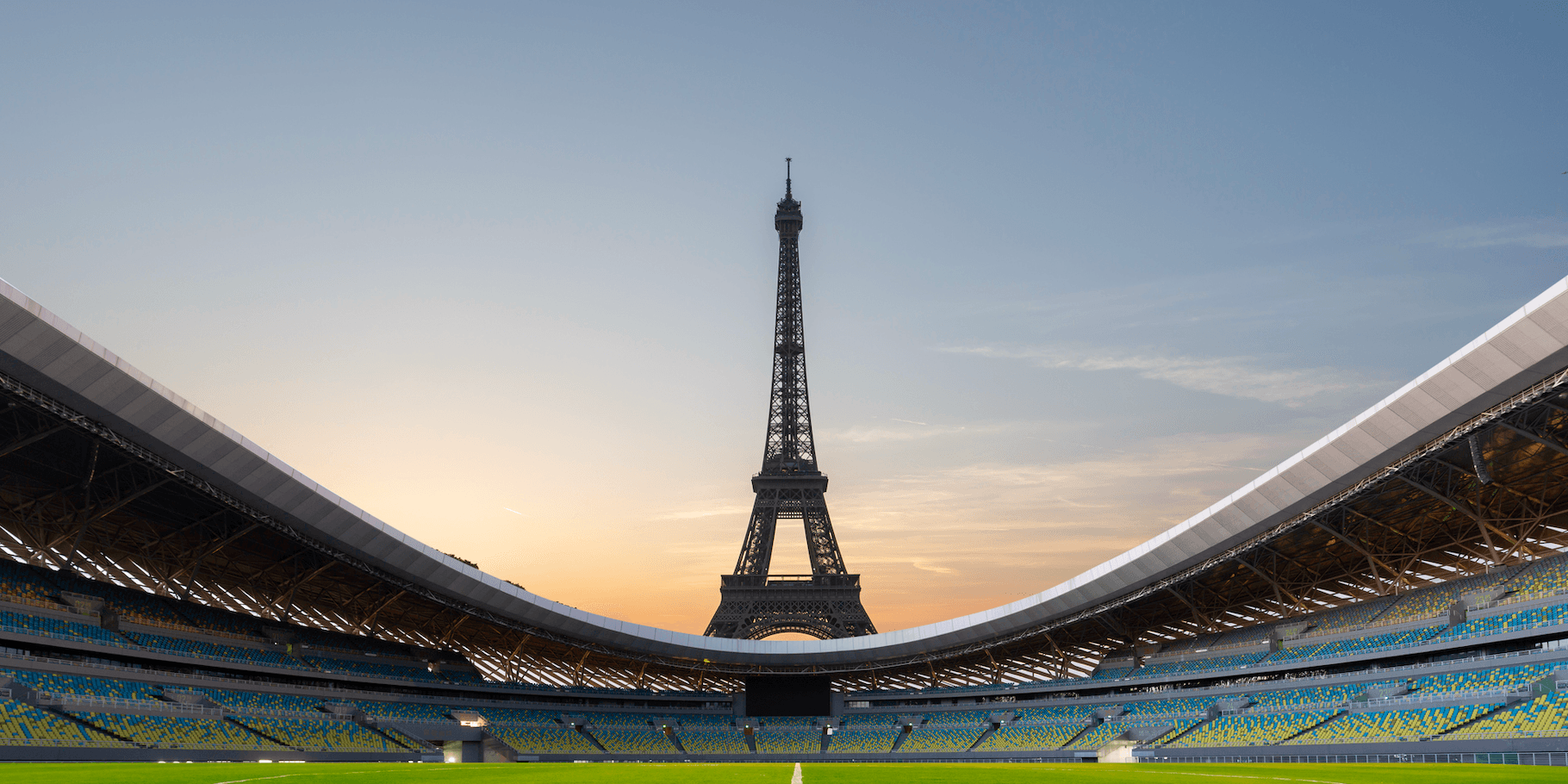 Vista desde el interior de un estadio, la Torre Eiffel se eleva imponente en la distancia