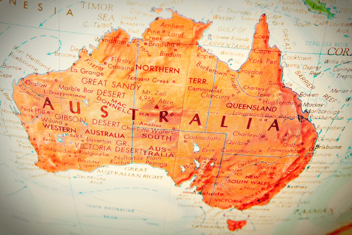 The Australian continent, painted orange and seen on a vintage globe.
