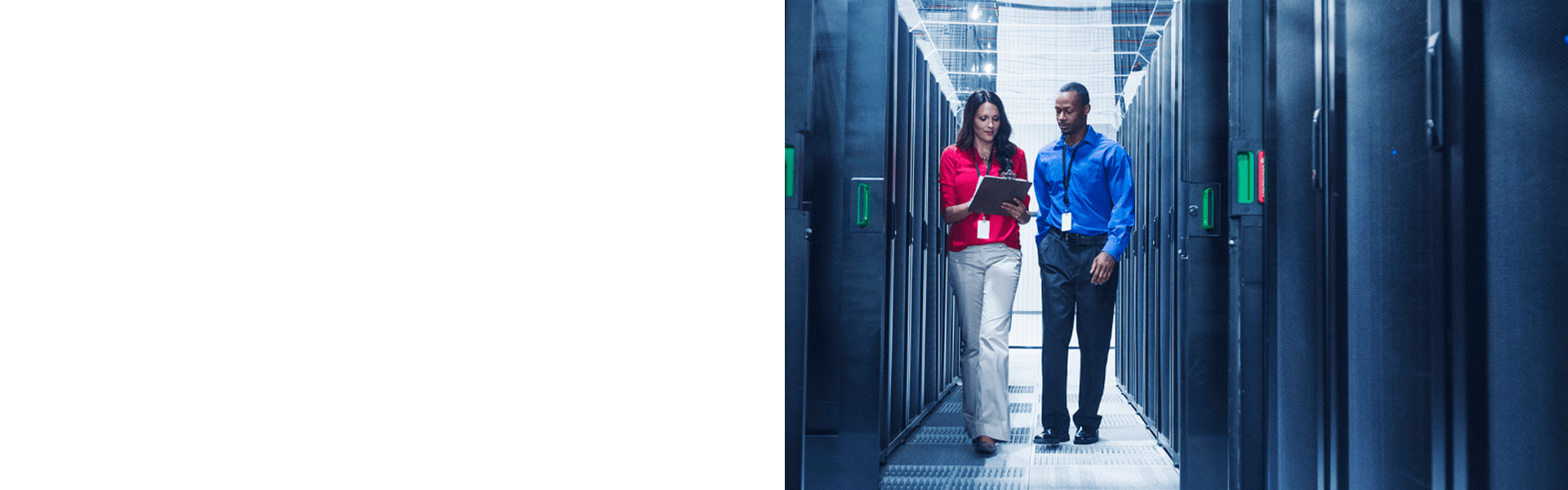 Two professionals working in data center with network infrastructure